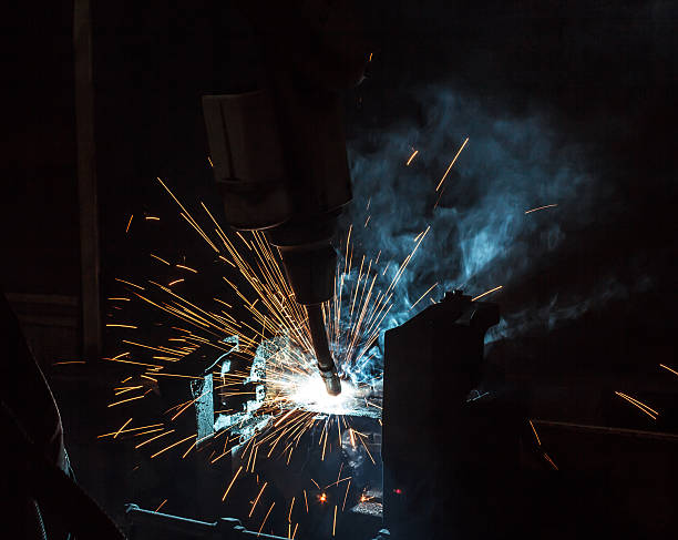 Sparks welding robot movement in an auto parts factory.